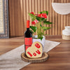 This Valentine's Day, show someone special they're on your mind with a bottle of wine, a potted Anthurium plant, a heart-shaped cookie that says ‘love’, and a live-edge serving board, America delivery 